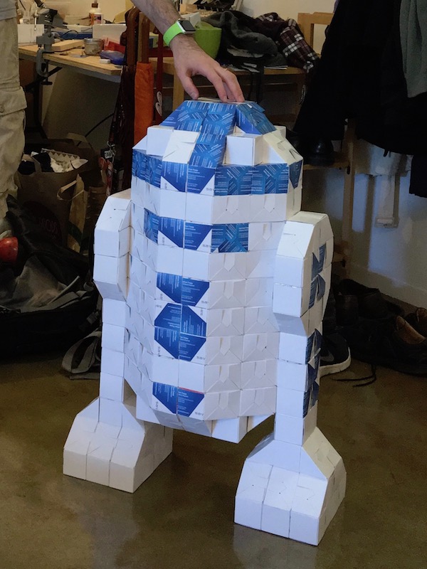 A life-size R2-D2 made from nearly 2,000 business cards.